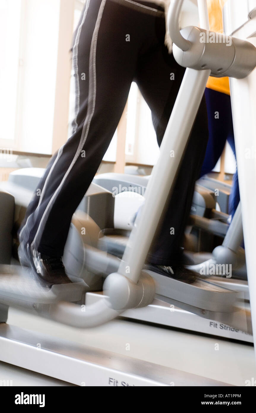 Woman work out on an Elliptical Exercise machine Stock Photo