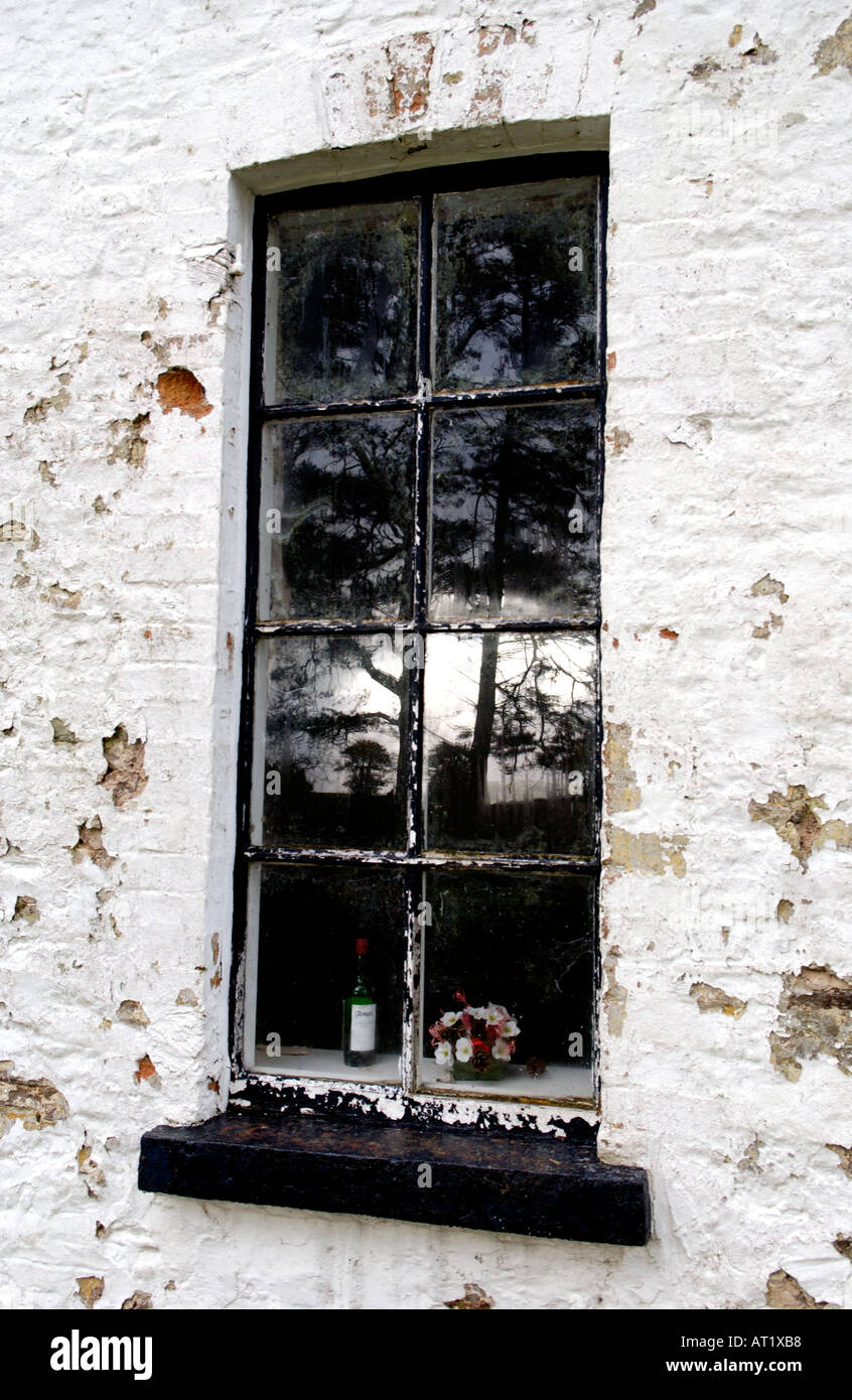 Old communion wine bottle in window of closed Welsh Bethesda Chapel at Brechfa near Brecon Powys Wales UK dated 1802 Stock Photo