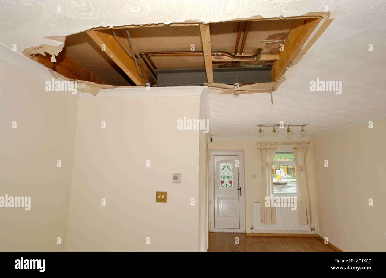 Ceiling In A Modern British House Damaged By A Leaking Water