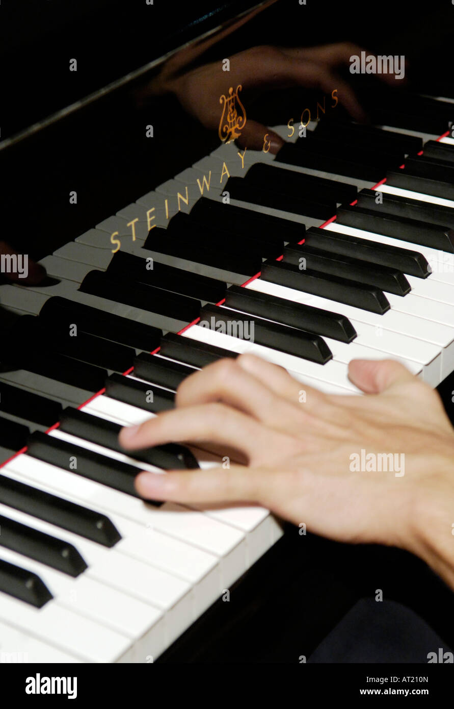 playing a steinway piano Stock Photo