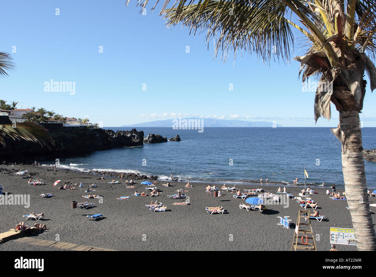 The beach of Playa de La Arena in Santiago del Teide Tenerife Canary  islands Spain The island of La Gomera is on the horizon Stock Photo - Alamy