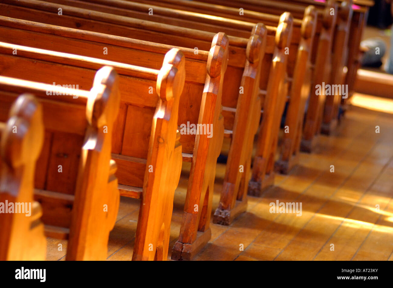 Line of wooden church pews in a church in London UK Stock Photo Alamy