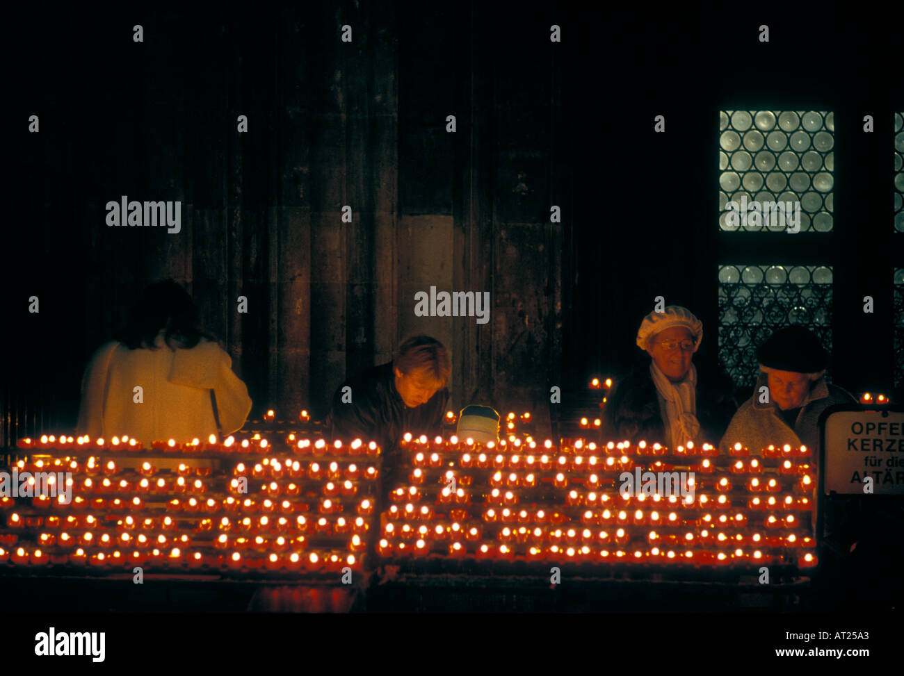 Covid coronavirus deaths death funerals, many candles being lit in a church for loved ones who have passed away in the Covid 19 pandemic Stock Photo