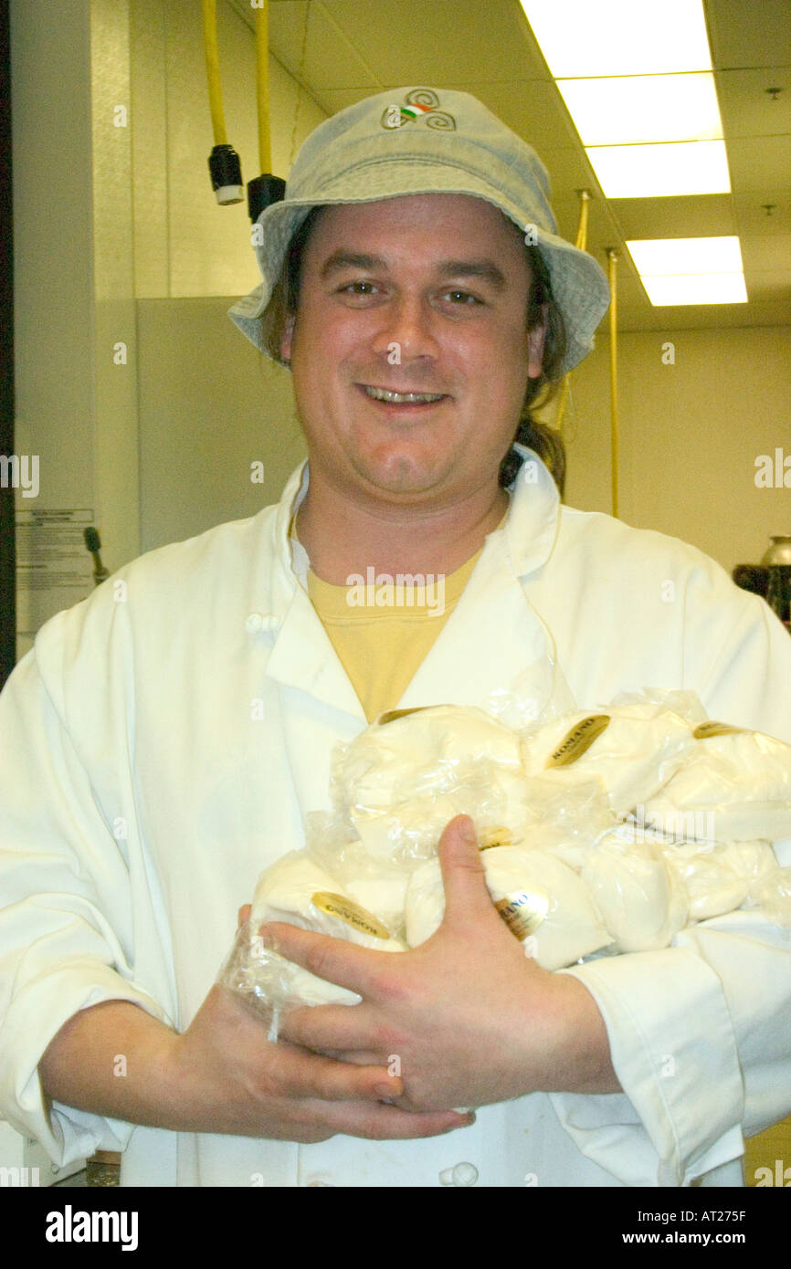 Happy cheese packager at the Mississippi Market a natural foods co-op located at Dale and Selby. St Paul Minnesota MN USA Stock Photo
