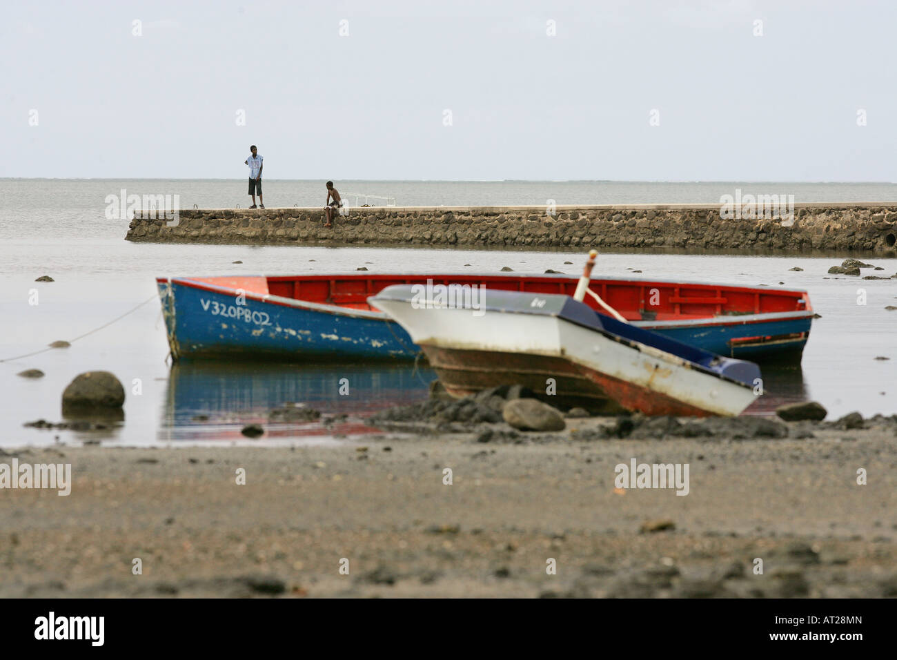 Two boys on Jetty, Mauritius Stock Photo