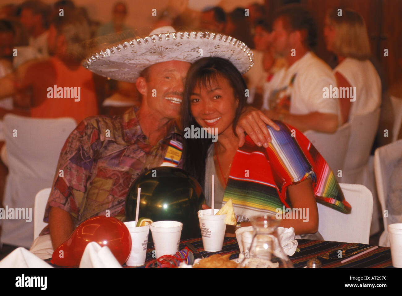 Couple enjoying party time on Mexican holiday Stock Photo