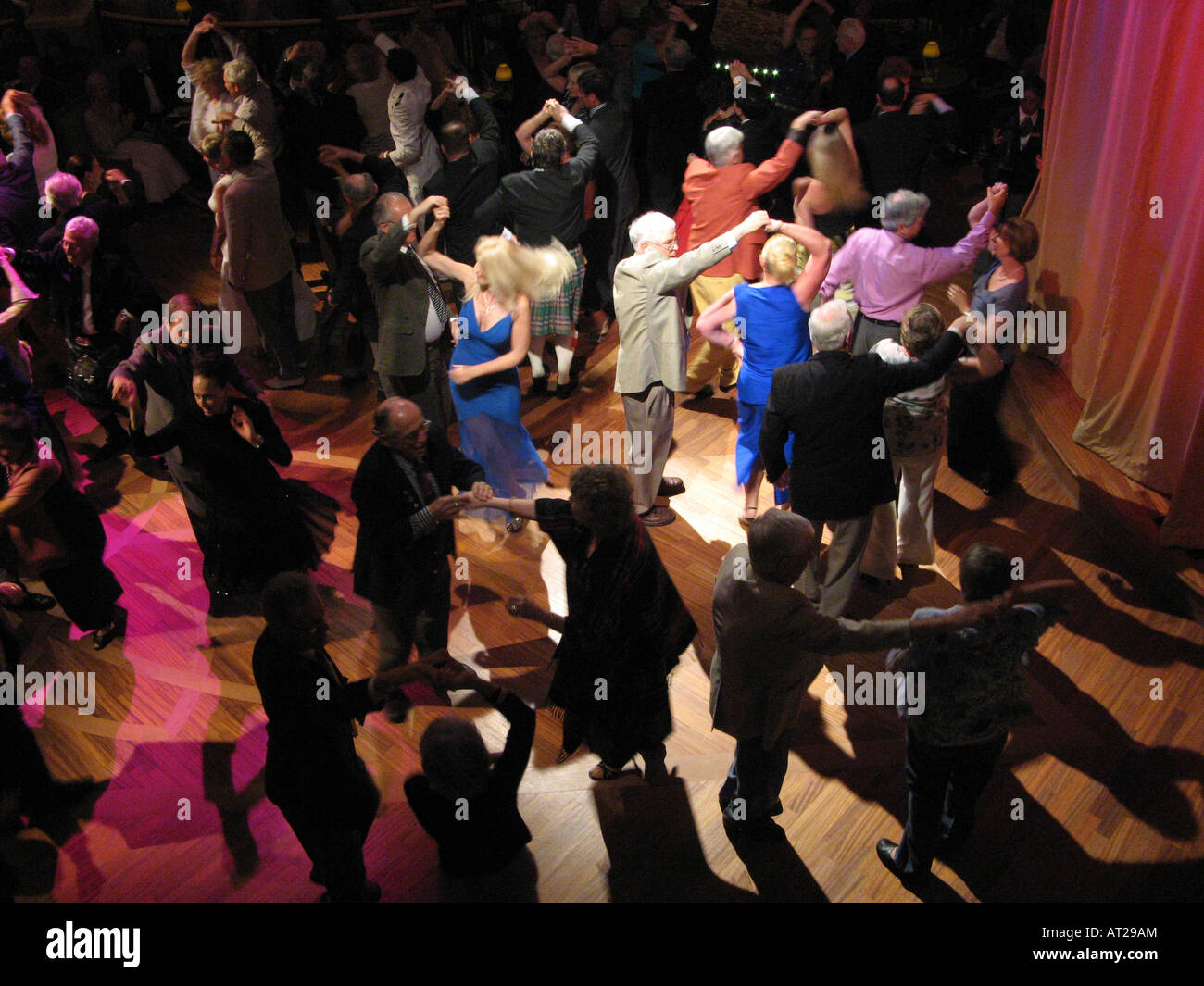 On Cunard's cruise ship, Queen Victoria, there's ballroom dancing almost every night in the Queens Room. Stock Photo