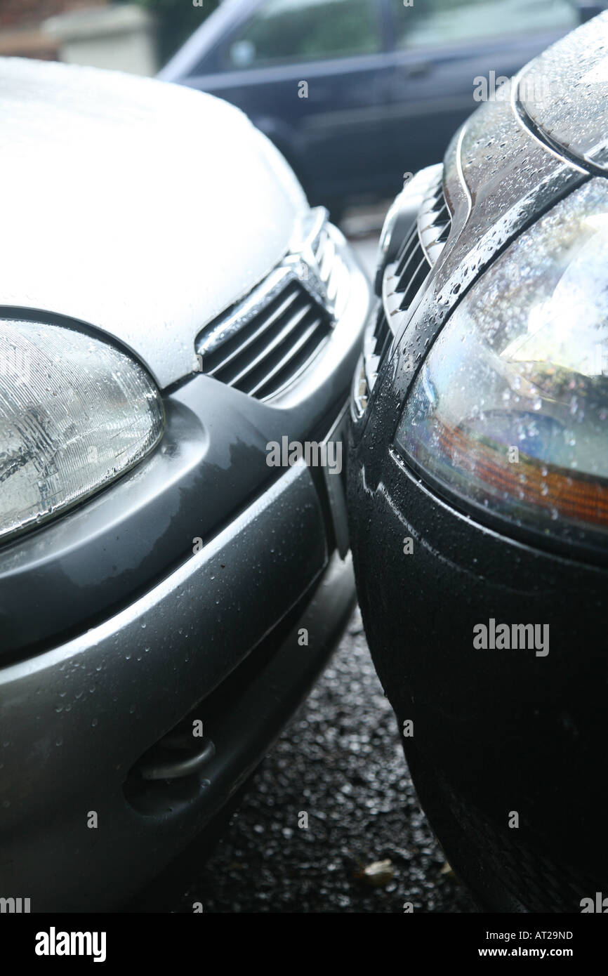 Two cars parked litrally bumper to bumper their bumpers are touching An
