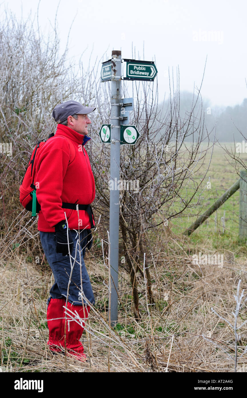 Walker by Footpath Sign , Lincolnshire , England Stock Photo Alamy