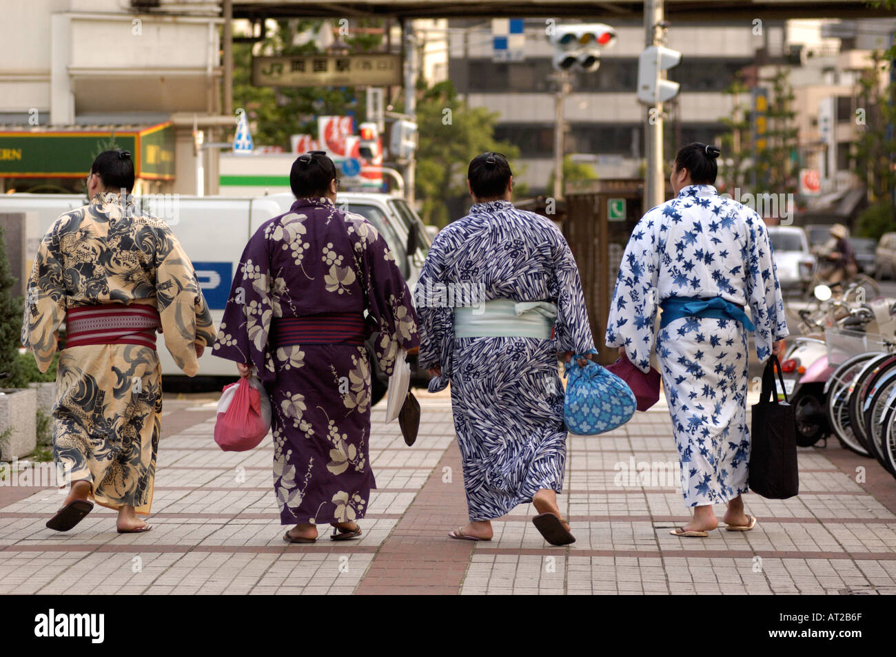 Sumo wrestlers walking home on the streets of Tokyo after completing ...