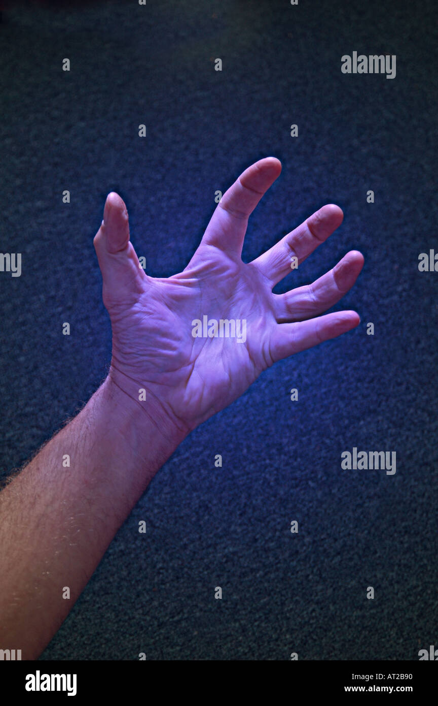 Hand grasping reaching for something concept Stock Photo Alamy