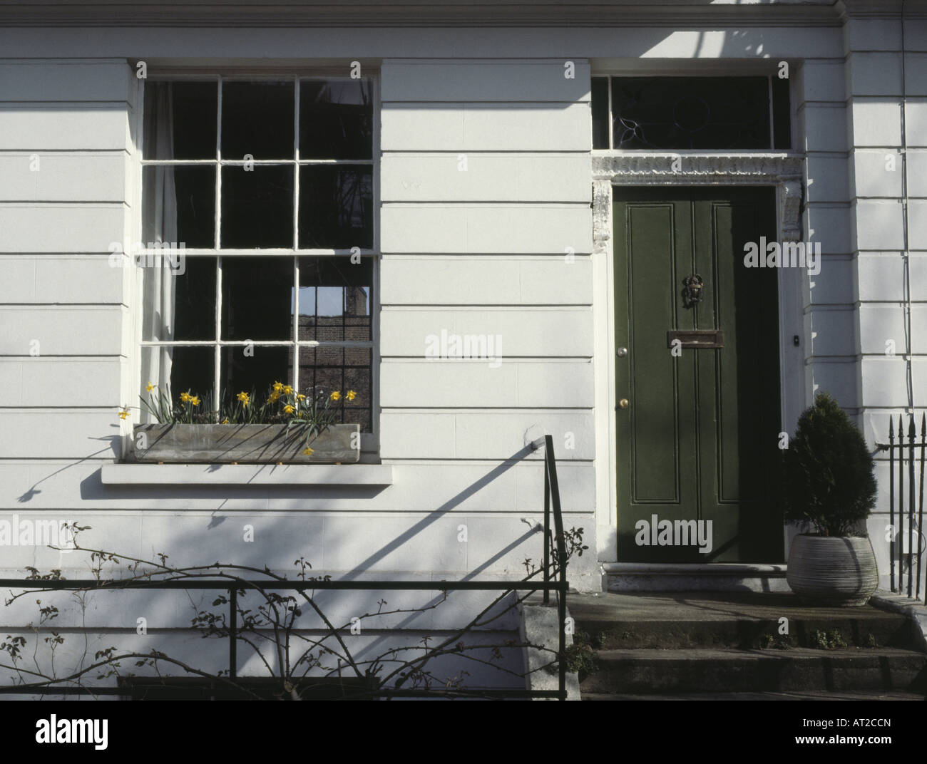 Green front door on traditional Victorian terraced house in North