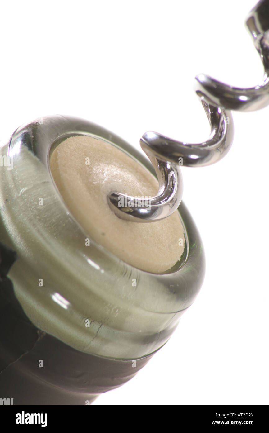 close up of corkscrew going into wine bottle cork Stock Photo