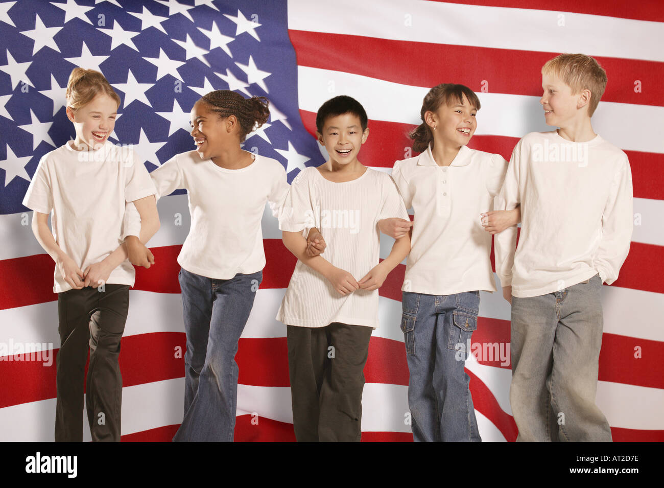 Children in front of American flag Stock Photo