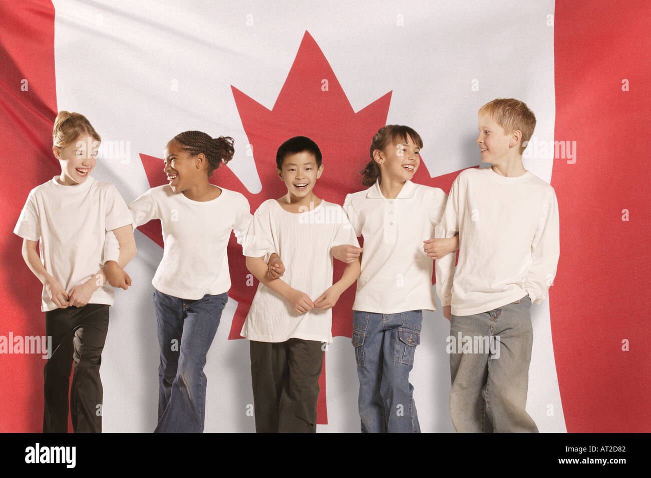 Children in front of Canadian Flag Stock Photo