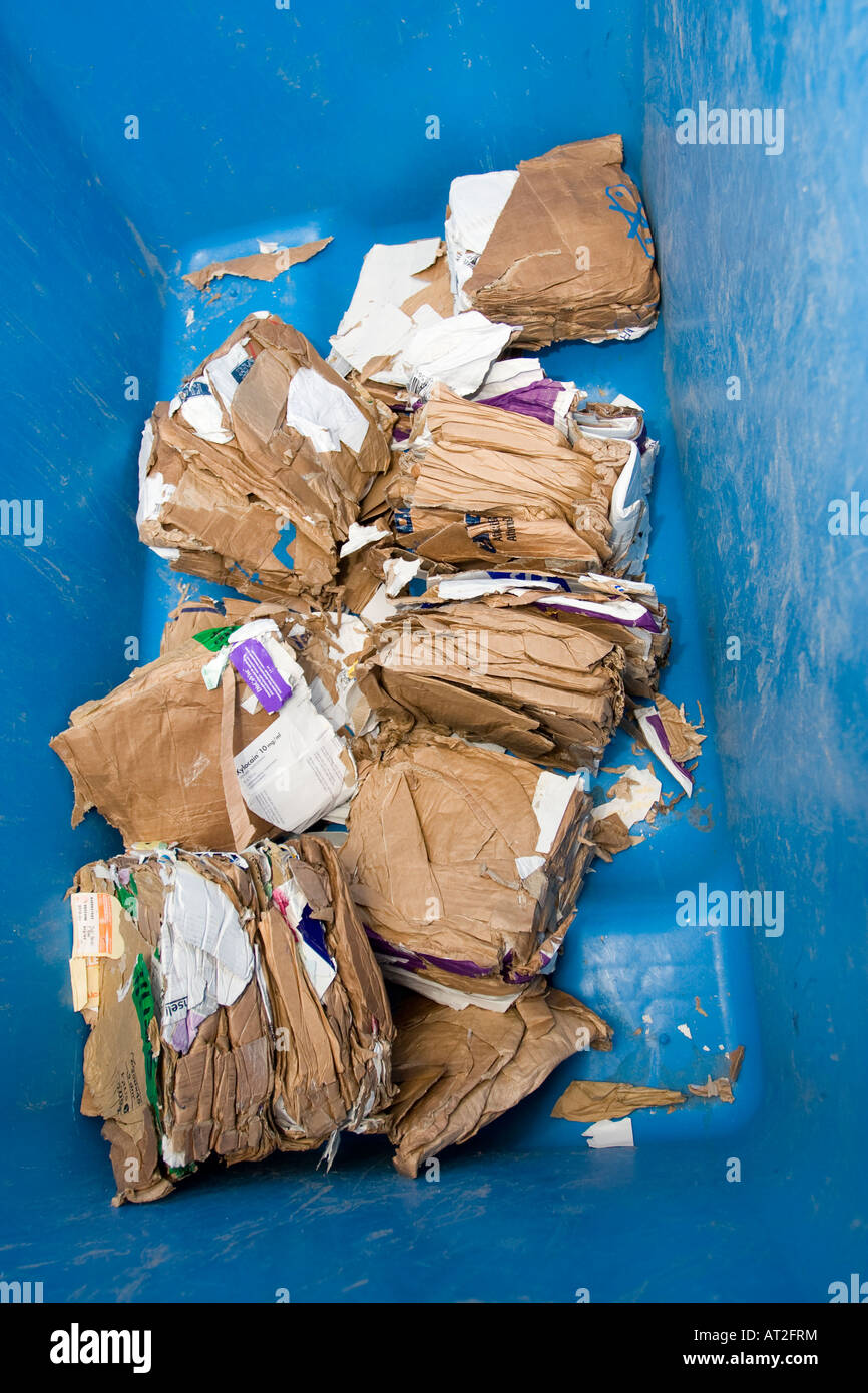 Papper for recycling in a container Stock Photo - Alamy