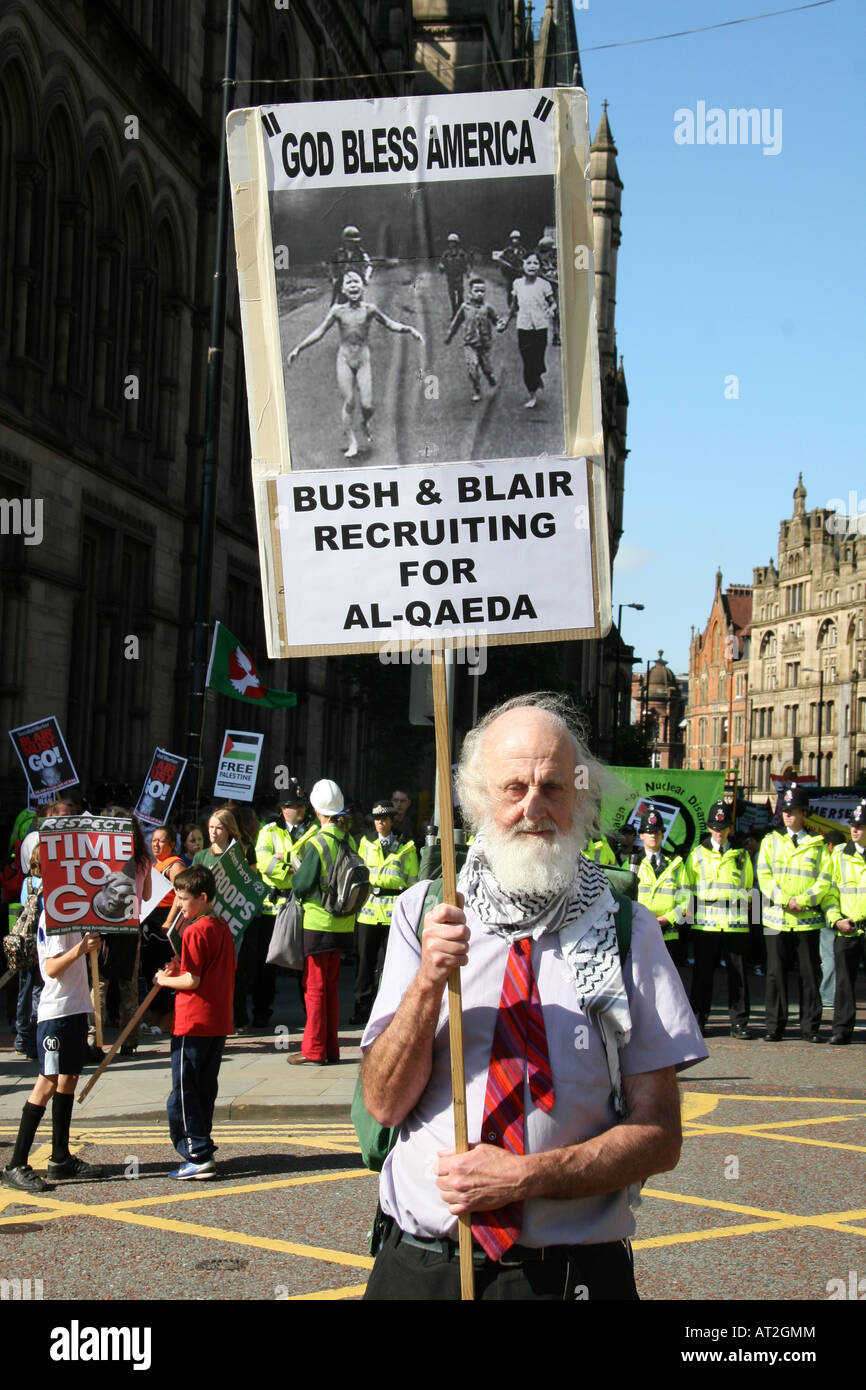 An Anti Iraq war protester holds a plaque during the rally against the labour party conference. Stock Photo