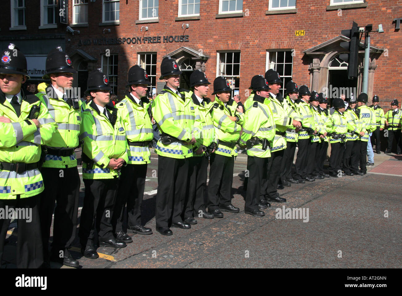 A line of Police head the front of the protest rally during the labour party conference. Stock Photo