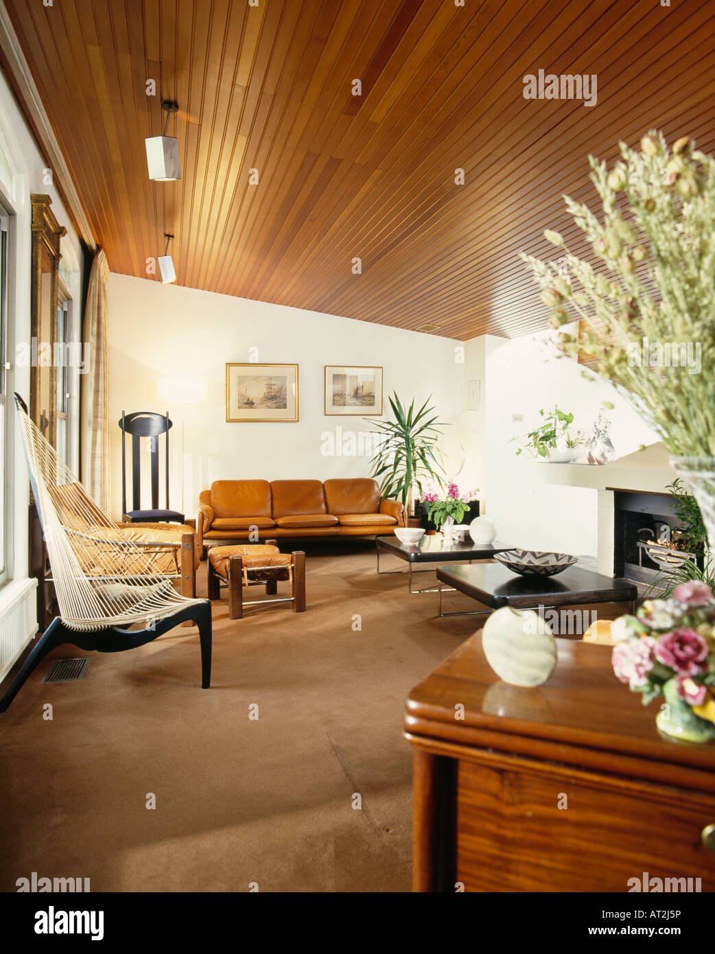 Harp chair by Hovelskov in seventies living room with wooden