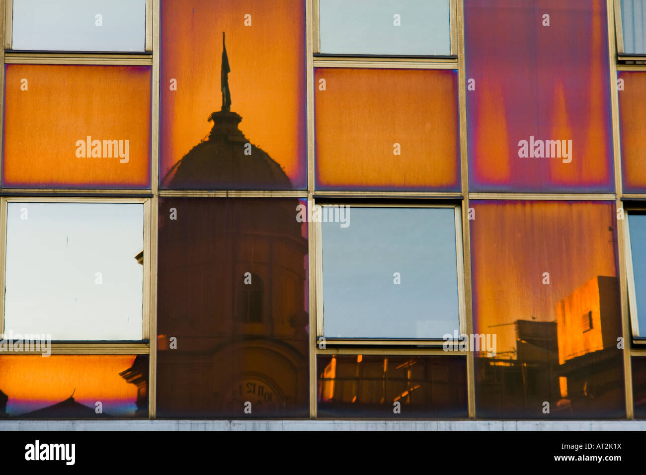 Clock tower reflected in windows on Kobler square, Rijeka in Croatia Stock Photo