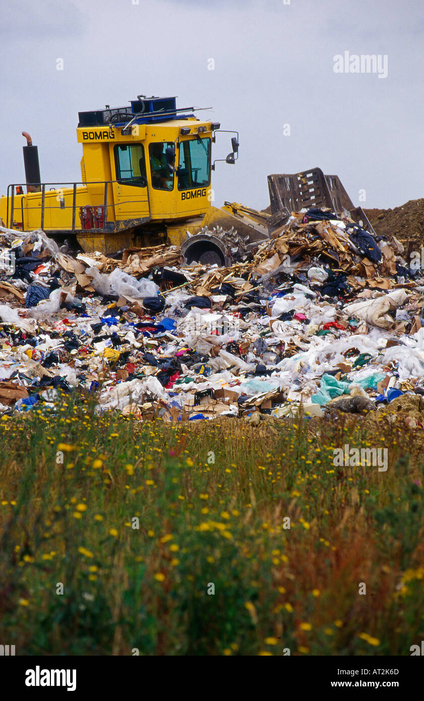 Waste compactor working at landfill site Borough Green Kent Stock Photo