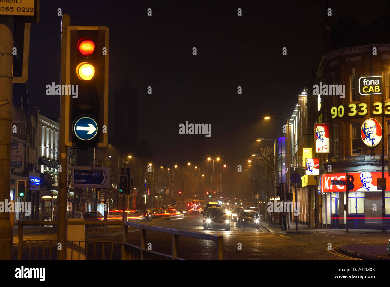 traffic lights at shaftesbury square belfast at night Stock Photo