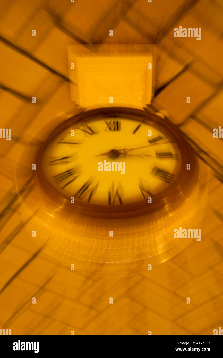 Clock hanging from the ceiling in an office building Stock Photo Alamy