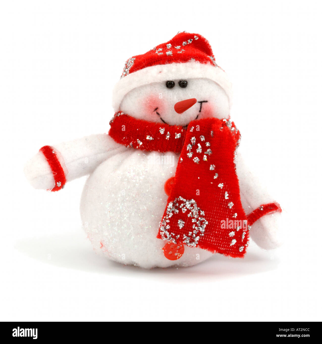 White Snowman with red santa hat and scarf furry toy on white background Stock Photo
