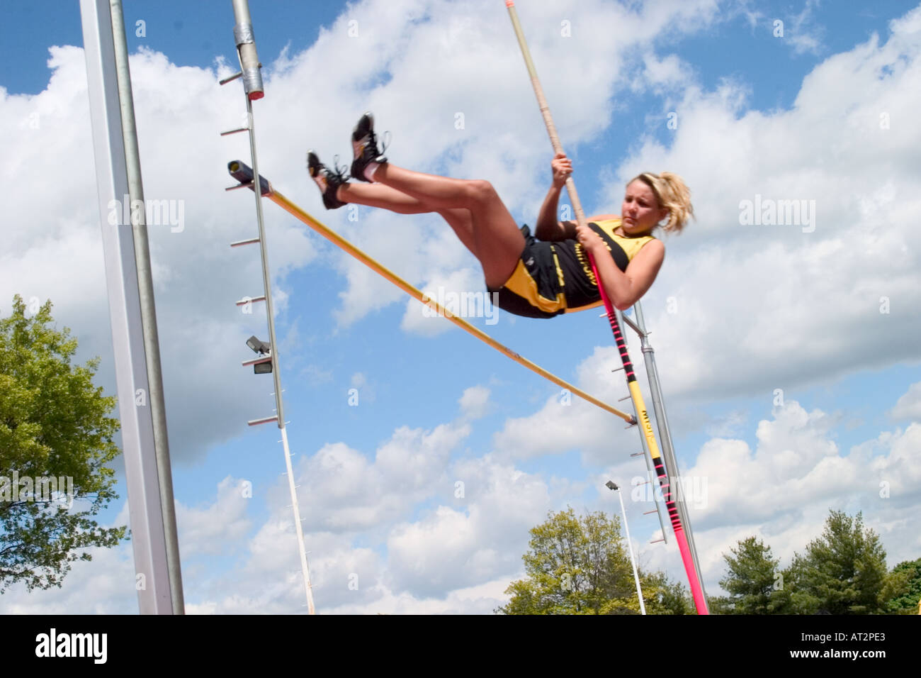 High school girl attempting a pole vault in a track and field meet Stock Photo Alamy