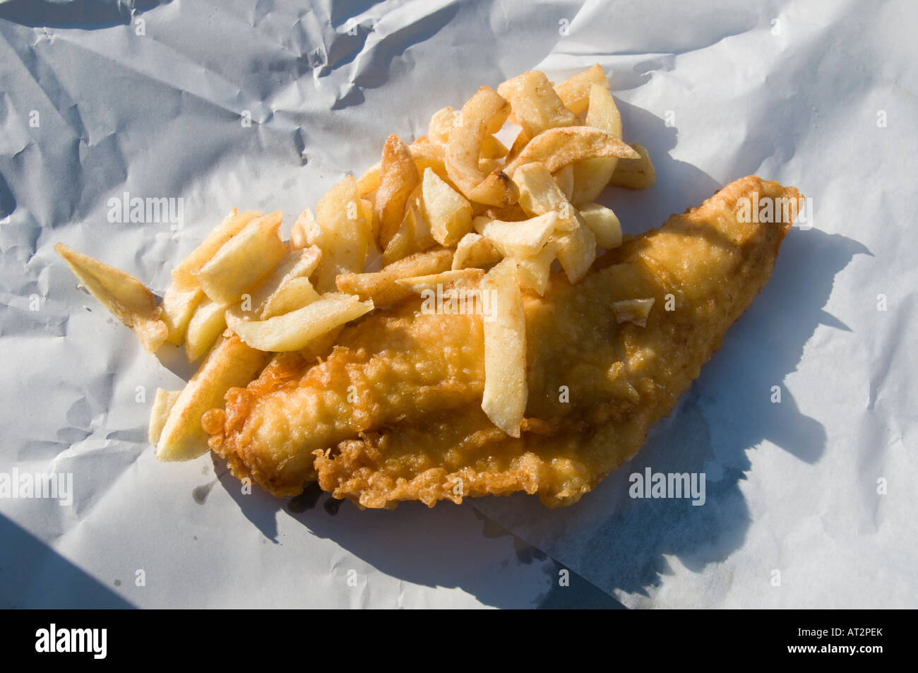 Fish and chips - cod in batter - fish supper, traditional British English fast food take-away meal, UK Stock Photo
