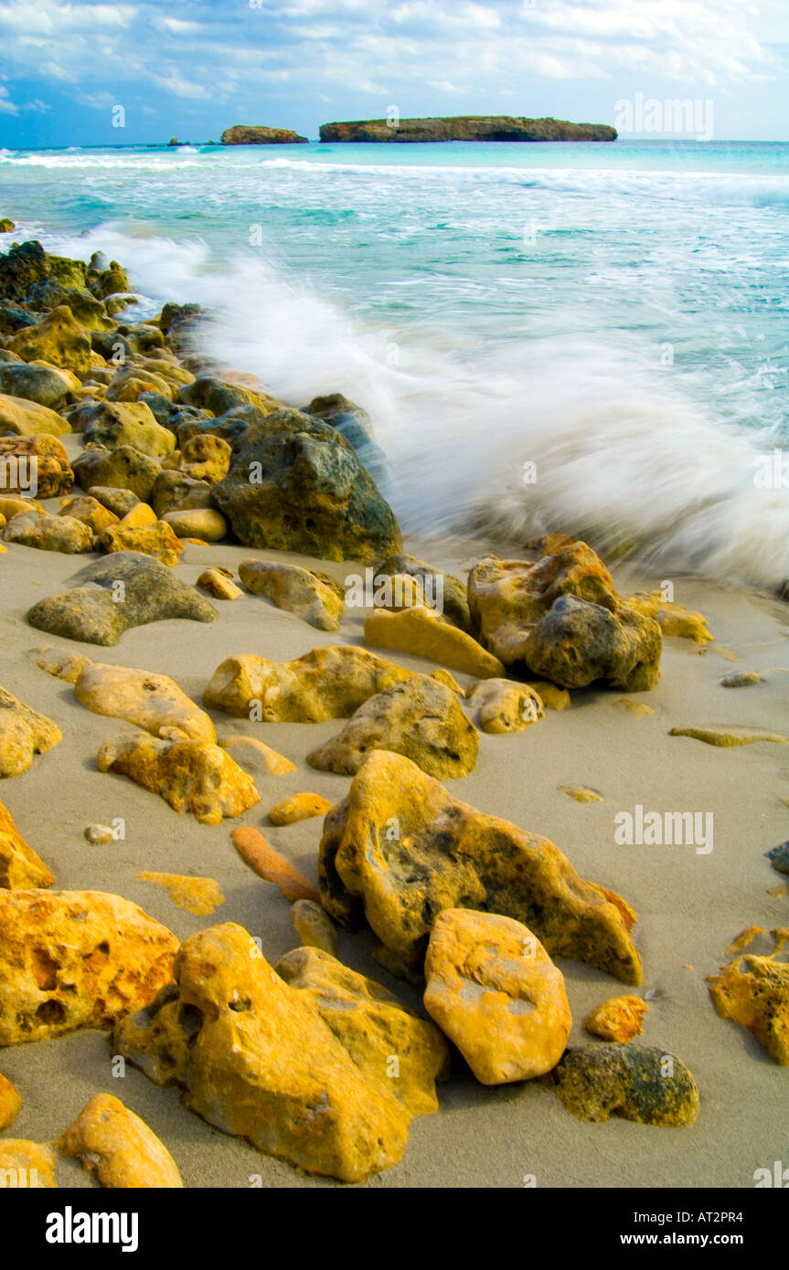 Beach view menorca island, waves breaking over rocks Stock Photo - Alamy