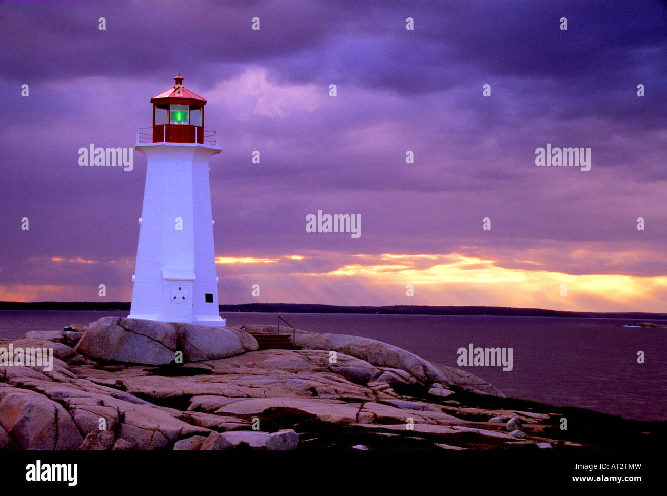 Peggy's Cove lighthouse just before a thunder storm at sunset, Nova