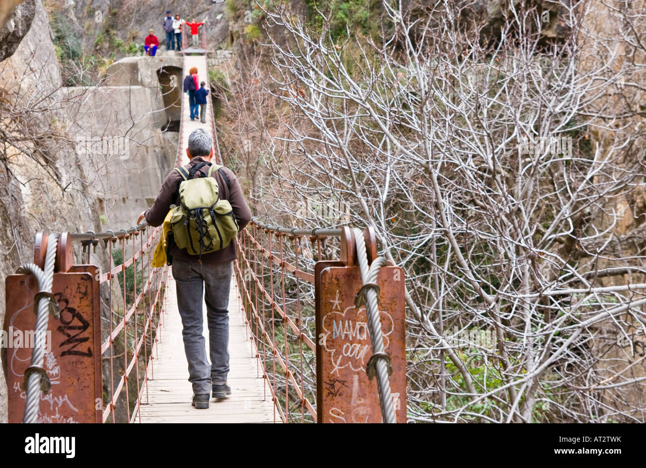 Family members crossing a suspension bridge Stock Photo - Alamy