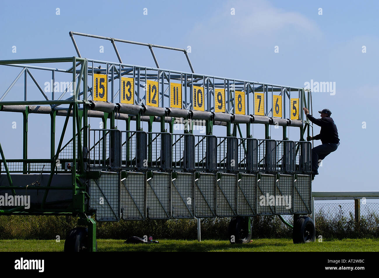 The starting stalls and a stall handler at Brighton races. Picture by