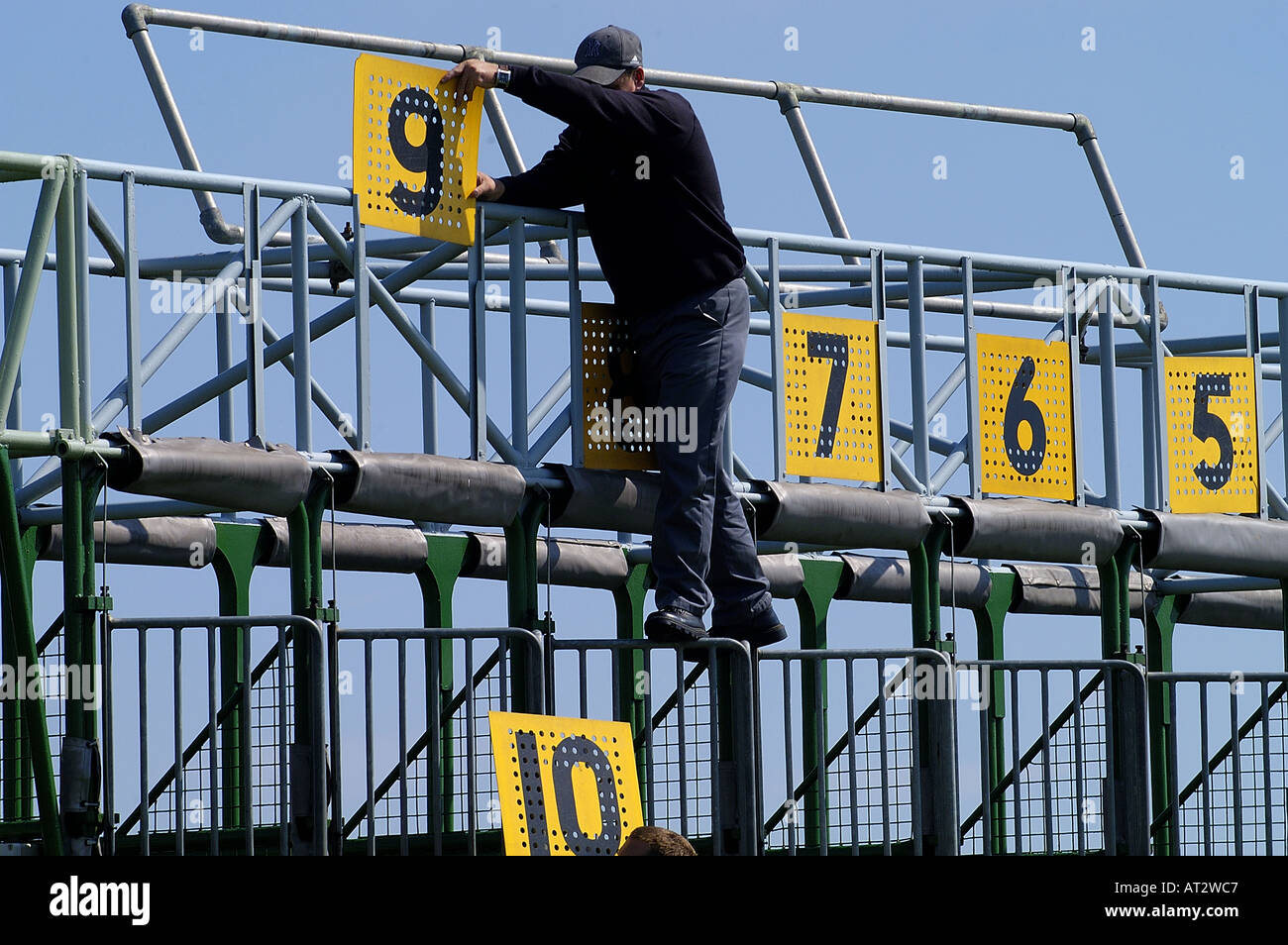 The starting stalls and a stall handler at Brighton races. Picture by