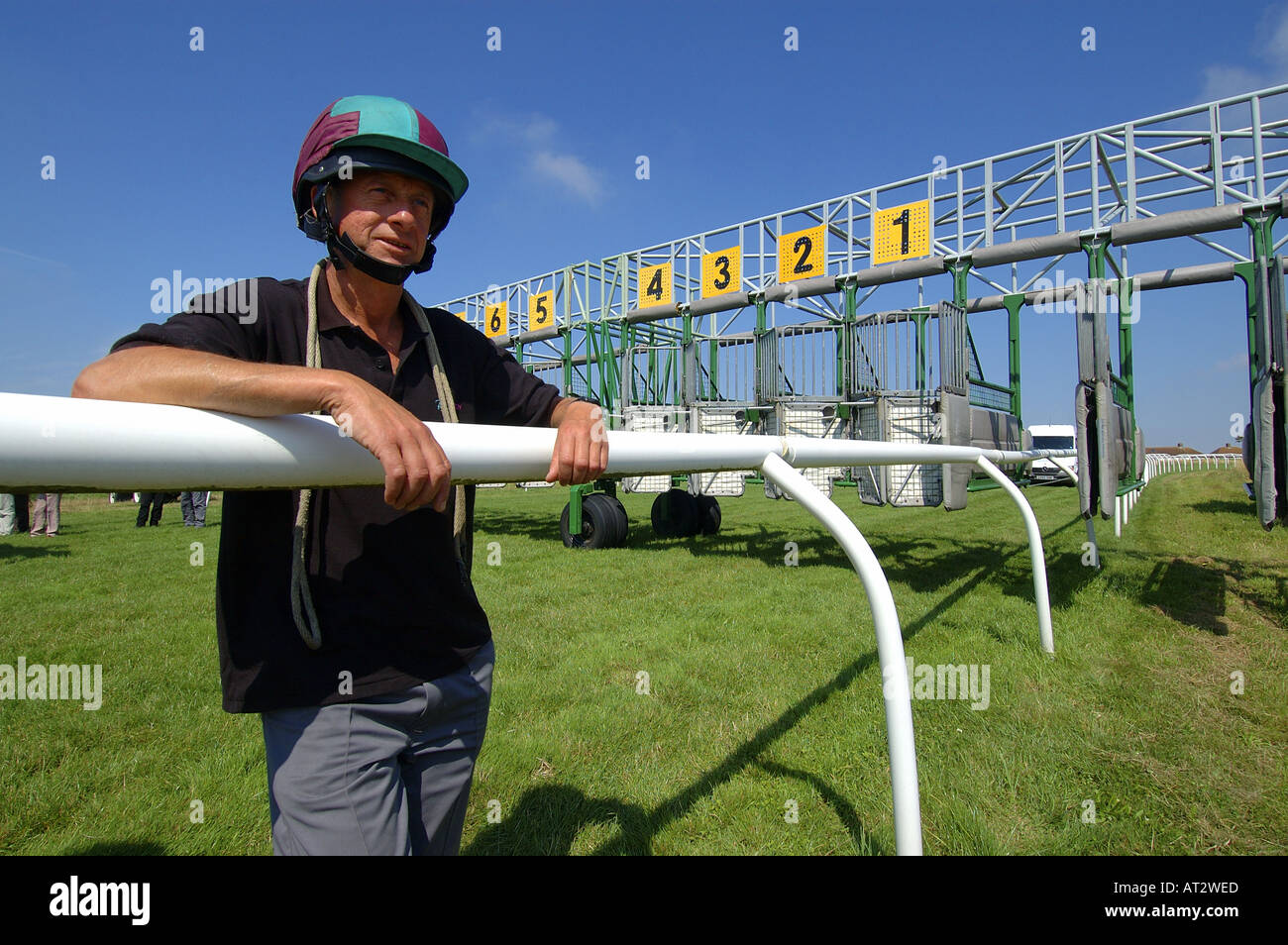 The starting stalls and a stall handler at Brighton races. Picture by
