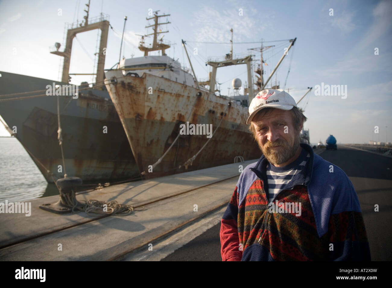 Ukranian sailor in front of his fishing boat, Huelva, Spain Stock Photo