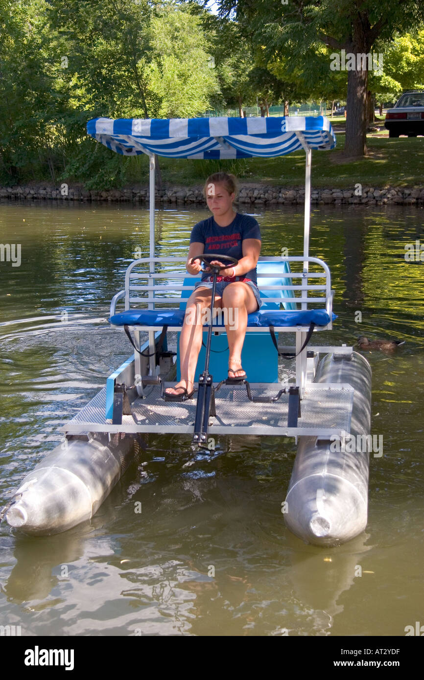 Fifteen year old girl uses a paddlewheel boat on the lagoon in Julia