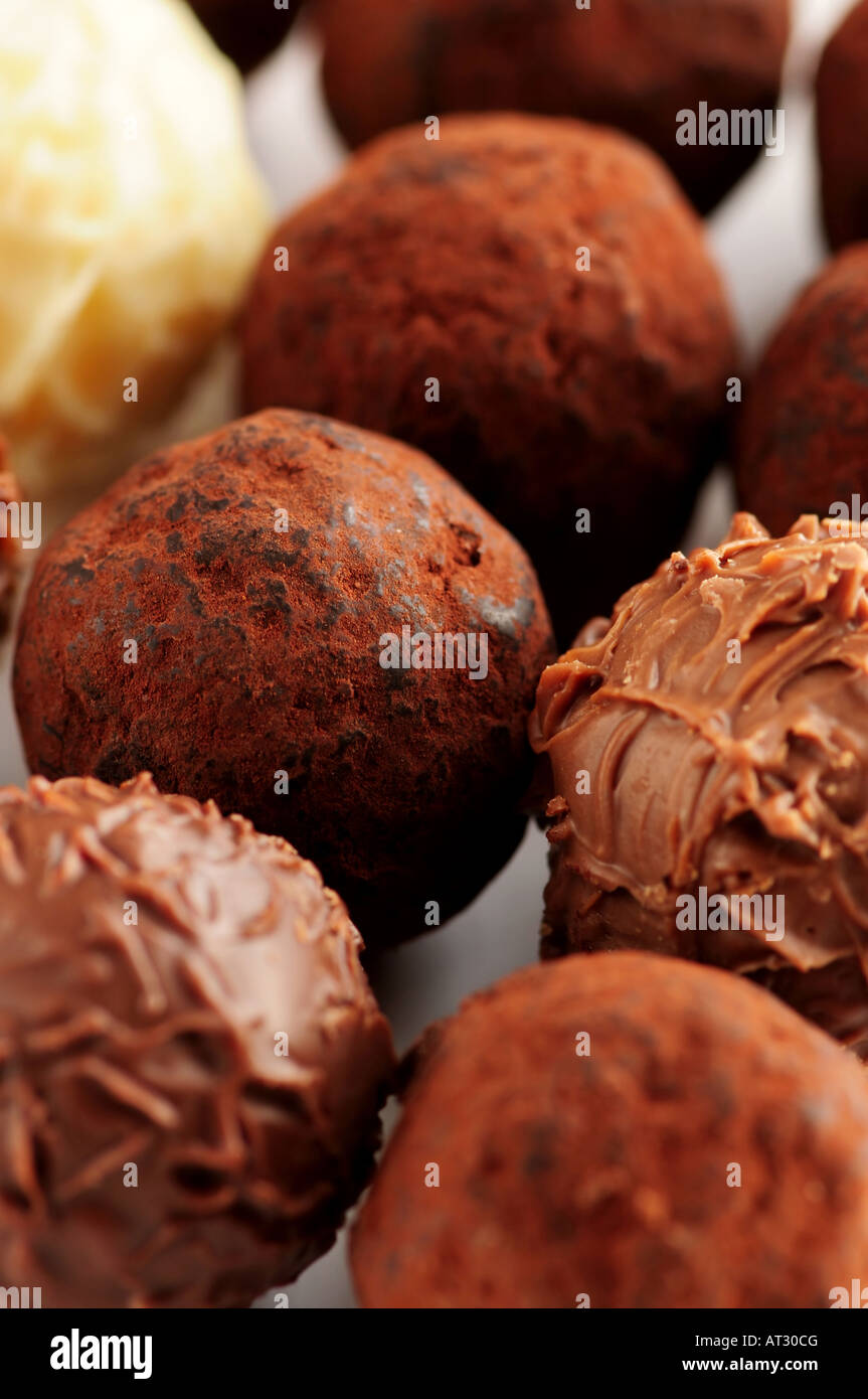 Several assorted gourmet chocolate truffles close up Stock Photo