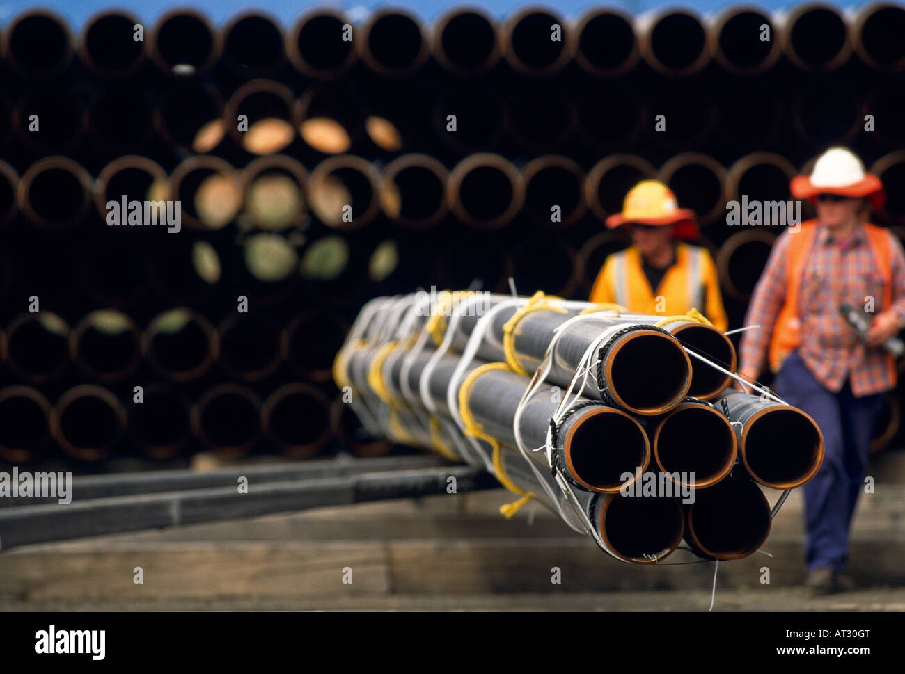 Workers checking [natural gas] pipes Stock Photo