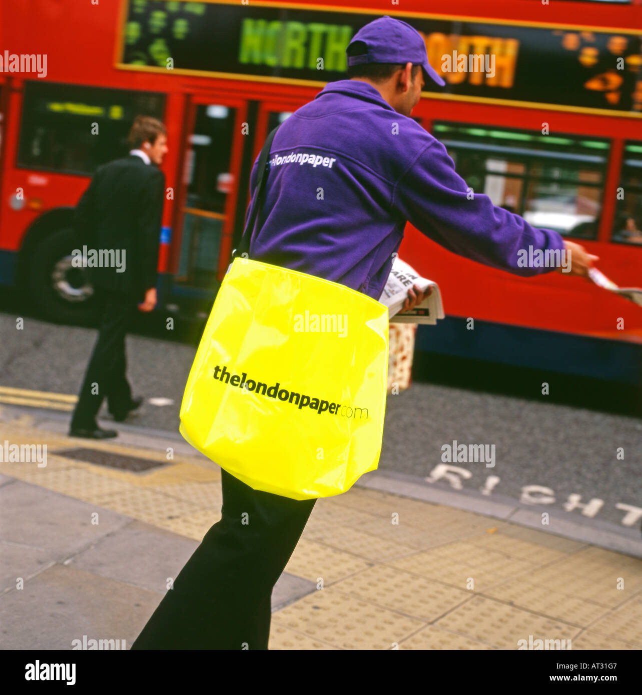 An man handing out The London Paper on the streets London UK Stock Photo