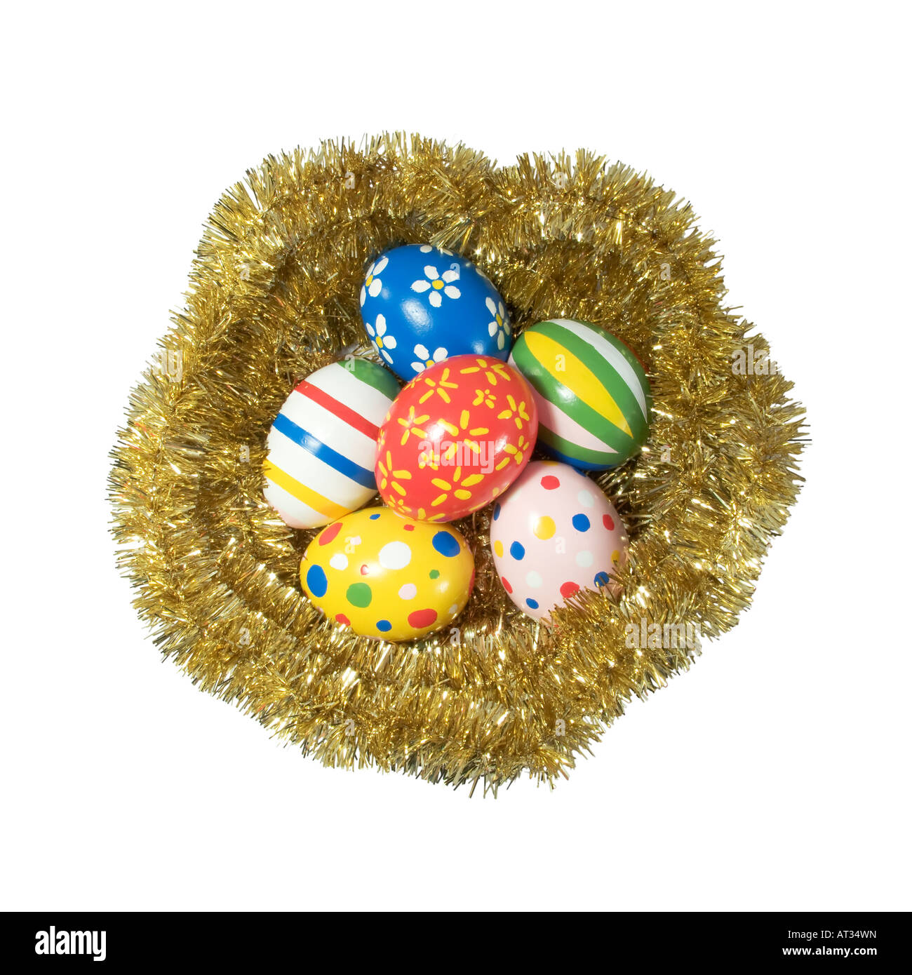 Real hand painted Easter eggs in a golden nest Stock Photo - Alamy