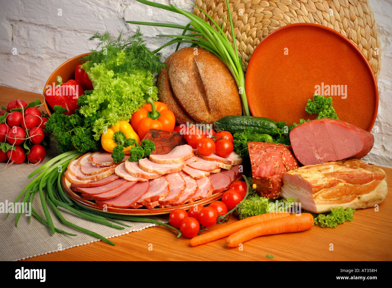 Ham cold meats platter with assorted vegetables bread Stock Photo