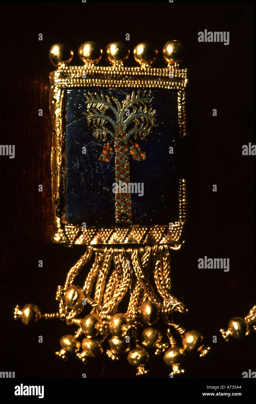 Gold pendant with precious stone inlay Assyrian royal treasure from Nimrud Iraq Stock Photo