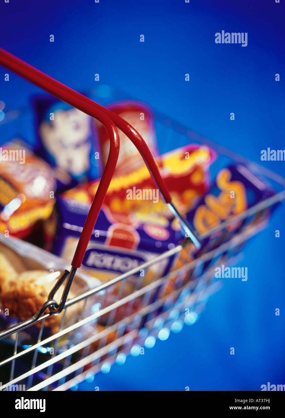 A shopping basket containing unhealthy food Stock Photo