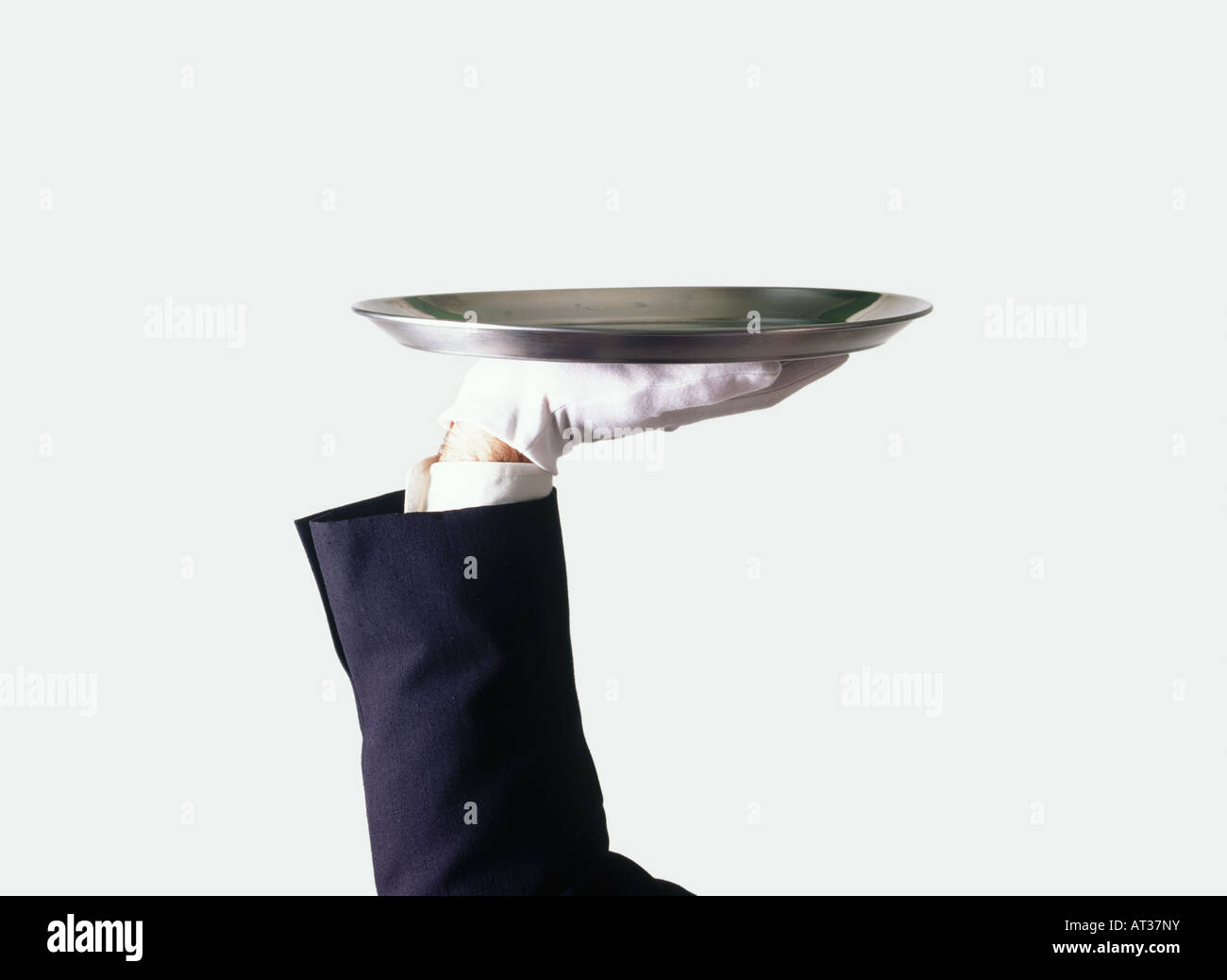 A waiter holding a silver tray Stock Photo