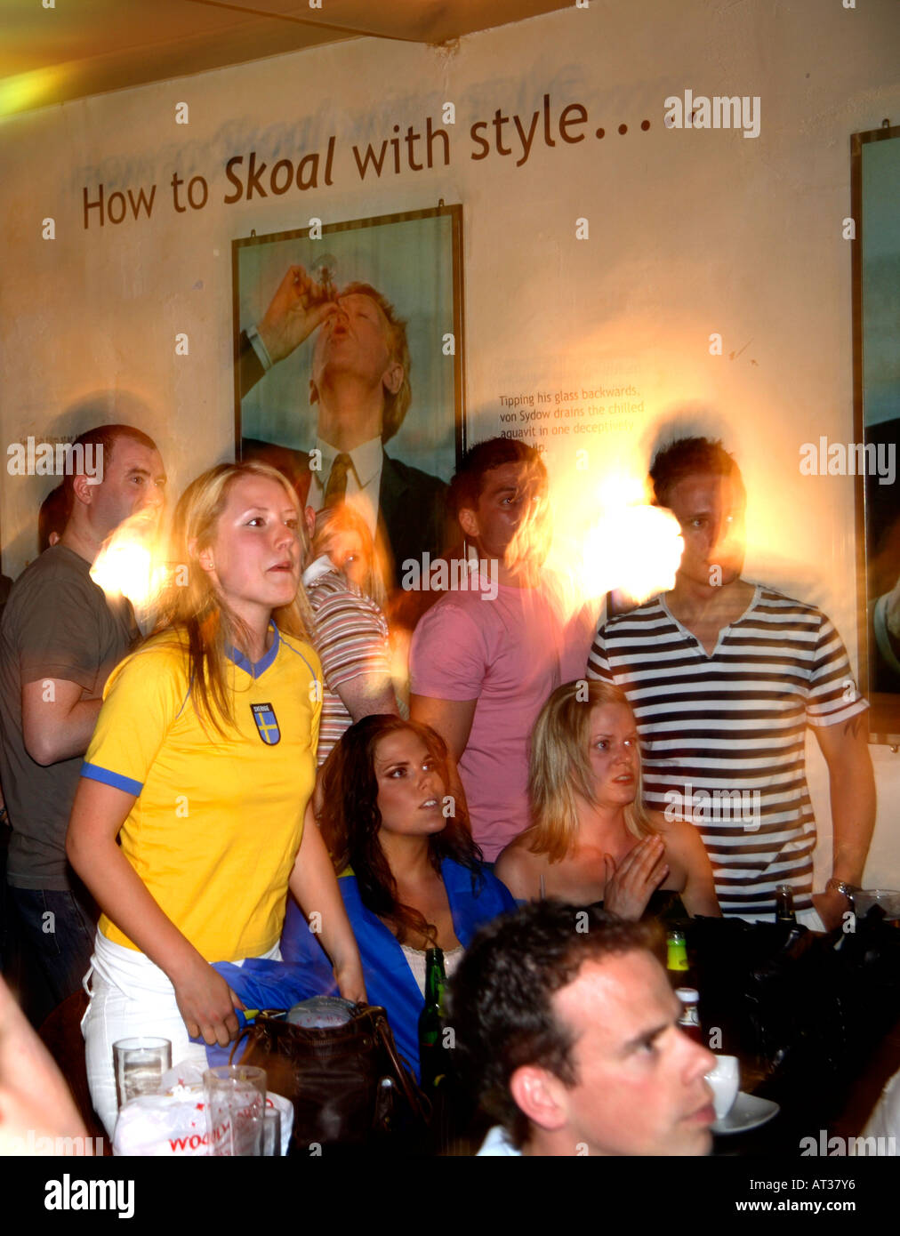 Swedish fans watching Sweden's opening game vs Trinidad & Tobago, World Cup 2006, Nordic Bar, London Stock Photo
