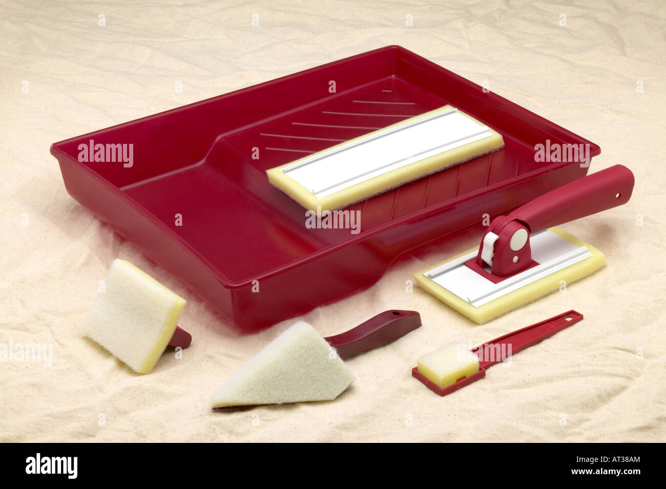 paint pads and tray laying on dust sheet Stock Photo