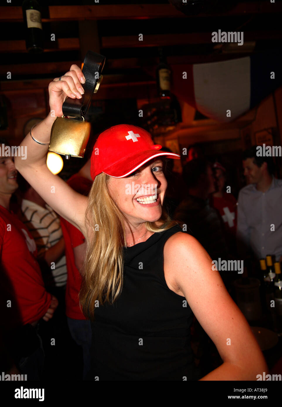 Swiss fan ringing cowbell celebrating Switzerland's goalless draw vs