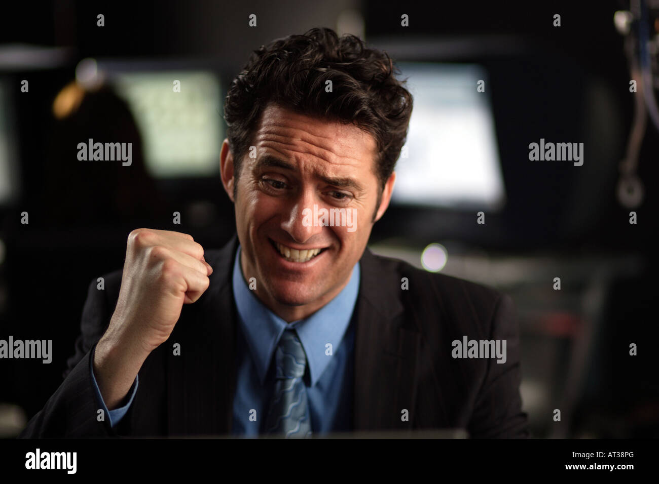 A business man punching the air in happiness Stock Photo